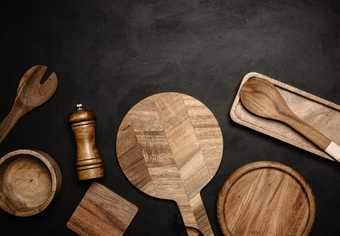 Various wooden kitchen utensils on black background, top view. Copy space Various wooden kitchen utensils on black background, top view. Copy space