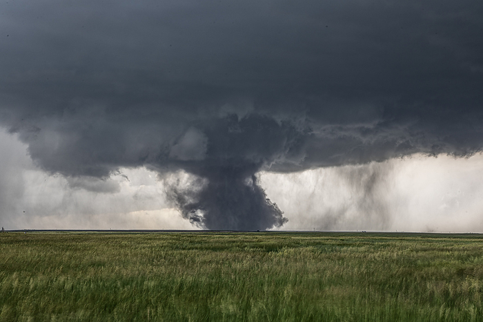 Large tornado, Kimball, Nebraska, USA A tornado is a violently rotating column of air descending from a mesocyclone associated with a supercell thunderstorm. This tornado formed south of the Kimball, Nebraska, USA. Photographed on 28th June 2023., by ROGER HILL SCIENCE PHOTO LIBRARY