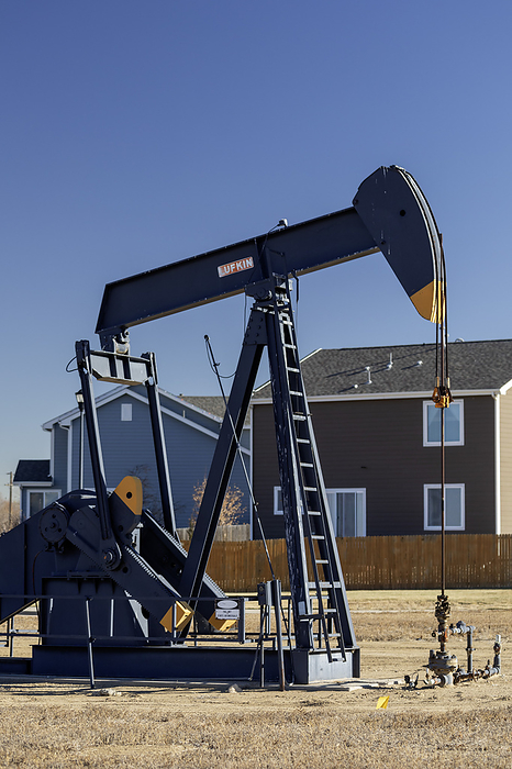 Oil well pumpjack Oil well pumpjack near a housing subdivision. Photographed in Frederick, Colorado, USA., by JIM WEST SCIENCE PHOTO LIBRARY