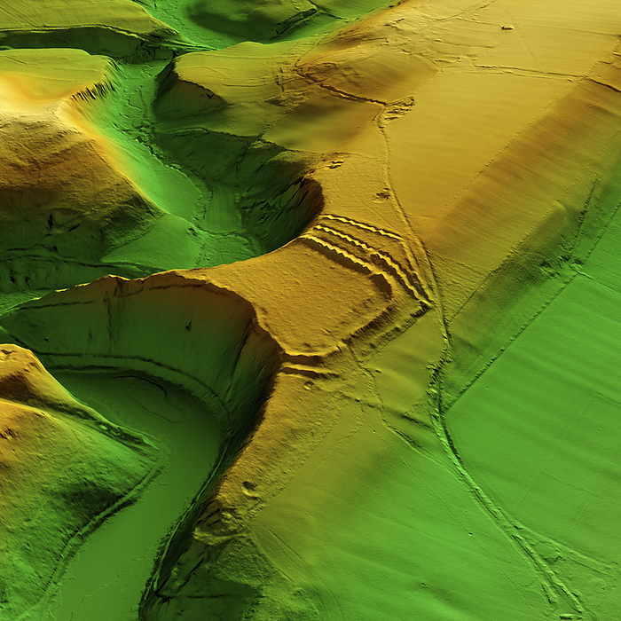 Bloody Acre Camp, UK, 3D LiDAR scan 3D LiDAR scan of Bloody Acre Camp in Gloucestershire, UK. The digital terrain model offers a view of the surrounding landscape without obstruction from foliage. This ancient hillfort is one of many hillforts found across the UK and dates back to the Iron Age, roughly between 700 BCE and 43 CE. These hillforts served as fortified settlements or defensive structures for ancient communities, offering protection and strategic control over the surrounding territory. Image contains UK public sector information licensed under the Open Government Licence v3.0., by SIMON TERREY SCIENCE PHOTO LIBRARY