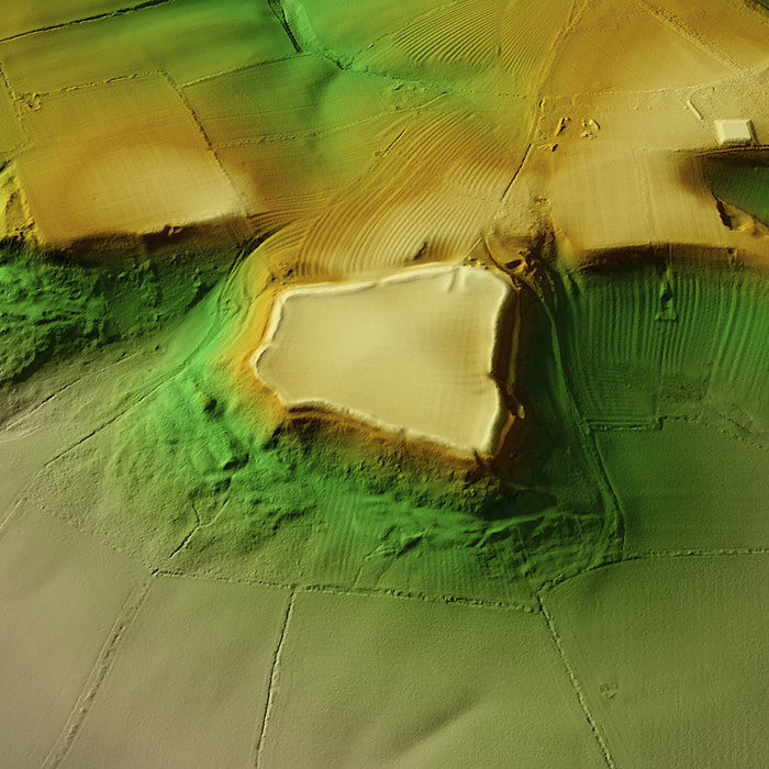Burrough Hill, UK, 3D LiDAR scan 3D LiDAR scan of Burrough Hill in Leicestershire, UK. The digital terrain model offers a view of the surrounding landscape without obstruction from foliage. This is one of many hillforts found across the UK and dates back to the Iron Age, over 2,000 years ago. It is trapezoidal in shape and covers an area of around 50,000 square metres. These hillforts are typically situated on hilltops and enclosed by earthworks such as ramparts and ditches. They served as fortified settlements or defensive structures for ancient communities, offering protection and control over the surrounding territory. Image contains UK public sector information licensed under the Open Government Licence v3.0., by SIMON TERREY SCIENCE PHOTO LIBRARY