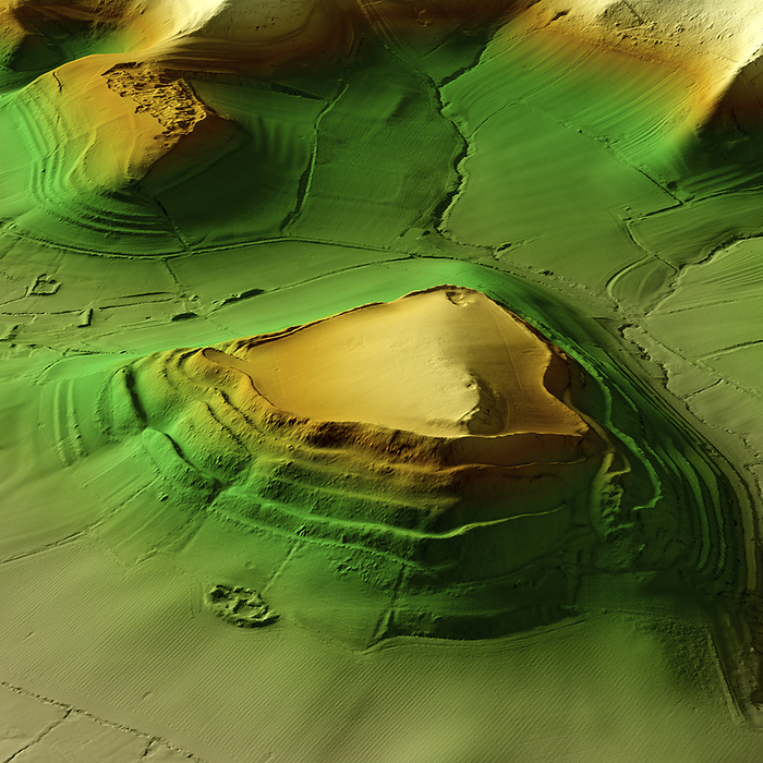Cadbury Castle, UK, 3D LiDAR scan 3D LiDAR scan of Cadbury Castle in Somerset, UK. The digital terrain model offers a view of the surrounding landscape without obstruction from foliage. This is one of the largest hillforts of many found across the UK. It dates back to the Bronze Age, over 2000 years ago. It is formed by 73,000 square metres of plateau surrounded by ramparts on the surrounding slopes. As a fortified settlement, Cadbury Castle provided defence and served as a focal point for the local community. During the Iron Age the fort was occupied by the Durotriges tribe before they were defeated by the Romans in 70 CE. Image contains UK public sector information licensed under the Open Government Licence v3.0., by SIMON TERREY SCIENCE PHOTO LIBRARY