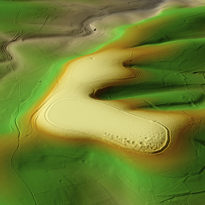 Cissbury Ring, UK, 3D LiDAR scan 3D LiDAR scan of Cissbury Ring in West Sussex, UK. The digital terrain model offers a view of the surrounding landscape without obstruction from foliage. This is one of the largest hillforts of many found across the UK, covering an area of around 260,000 square metres. It dates back to the Iron Age, over 2000 years ago. These hillforts are typically situated on hilltops and enclosed by earthworks such as ramparts and ditches. They served as fortified settlements or defensive structures for ancient communities, offering protection and control over the surrounding territory. Image contains UK public sector information licensed under the Open Government Licence v3.0., by SIMON TERREY SCIENCE PHOTO LIBRARY