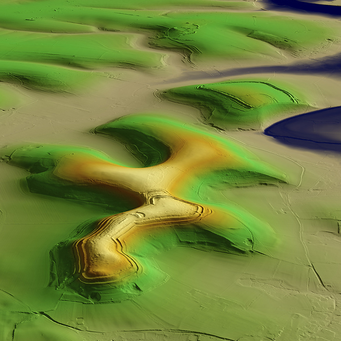 Hambledon Hill, UK, 3D LiDAR scan 3D LiDAR model of Hambledon Hill, an Iron Age hillfort in Dorset, UK. The digital terrain model offers a view of the surrounding landscape without obstruction from foliage. Hillforts were settlements constructed on natural hills, typically fortified with earthworks around the contours of the hill. They were widely constructed across Britain and Ireland in the centuries preceding the Roman conquest of the regions. Hambledon hilltop is encircled by an Iron Age earthwork and there are extensive Neolithic features, making it a major archaeological site. Image contains UK public sector information licensed under the Open Government Licence v3.0., by SIMON TERREY SCIENCE PHOTO LIBRARY