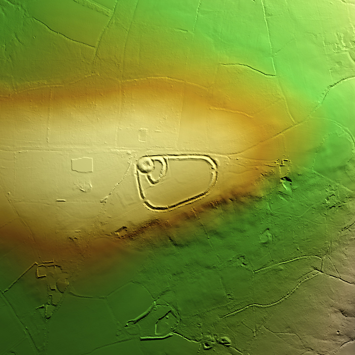 Blackdown Rings, UK, 3D LiDAR scan 3D LiDAR model of Blackdown Rings, an Iron Age hillfort in Devon, UK. The digital terrain model offers a view of the surrounding landscape without obstruction from foliage. The hillfort consists of earthworks and remains of a medieval ringwork that includes an earth bank, which is 30 metres in diameter at the base, surrounded by a ditch. Hillforts were settlements built on natural hills, fortified with earthworks around the hill s contours. These were widely constructed across Britain and Ireland in the centuries leading up to the Roman conquest of these regions. Image contains UK public sector information licensed under the Open Government Licence v3.0., by SIMON TERREY SCIENCE PHOTO LIBRARY