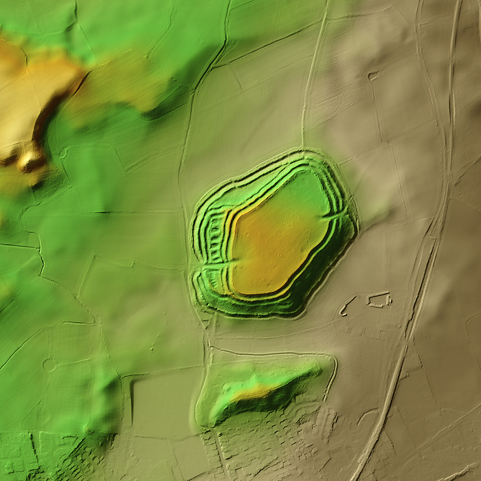 Old Oswestry, UK, 3D LiDAR scan 3D LiDAR model of Old Oswestry in Shropshire, UK. The digital terrain model offers a view of the surrounding landscape without obstruction from foliage. Old Oswestry was built and occupied during the Iron Age  800 BCE to 43 CE  and is one of the best preserved hillforts in Britain. Hillforts were widely constructed across Britain and Ireland in the centuries leading up to the Roman conquest of these regions. This is a fine example of a  multivallate  or multiple rampart hillfort. It remained in use for almost 1,000 years. Image contains UK public sector information licensed under the Open Government Licence v3.0., by SIMON TERREY SCIENCE PHOTO LIBRARY