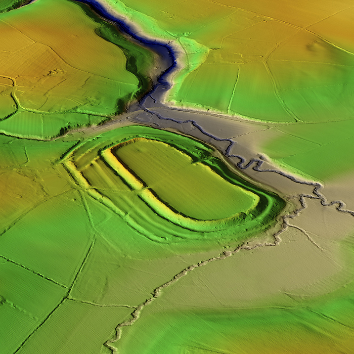 Risbury Camp, UK, 3D LiDAR scan 3D LiDAR model of Risbury Camp, an Iron Age hillfort in Herefordshire, UK. The digital terrain model offers a view of the surrounding landscape without obstruction from foliage. Hillforts were settlements constructed on natural hills, typically fortified with earthworks around the contours of the hill. They were widely constructed across Britain and Ireland in the centuries preceding the Roman conquest of the regions. Risbury Camp consists of a flat topped knoll, the levelling may be partly artificial. Its defences follow natural contours, with two ramparts. Image contains UK public sector information licensed under the Open Government Licence v3.0., by SIMON TERREY SCIENCE PHOTO LIBRARY