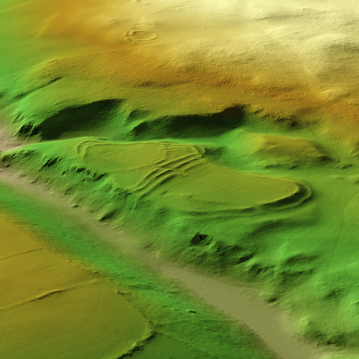 The Kettles, UK, 3D LiDAR scan 3D LiDAR scan of The Kettles in Northumberland, UK. The digital terrain model offers a view of the surrounding landscape without obstruction from foliage. This ancient hillfort is one of many found across the UK and dates back to the Iron Age, roughly between 700 BC and 43 AD. These hillforts served as fortified settlements or defensive structures for ancient communities, offering protection and strategic control over the surrounding territory. The fort occupies a natural ridge protected on three sides by steep slopes. The hill fort is divided into two sections by triple ramparts. Image contains UK public sector information licensed under the Open Government Licence v3.0., by SIMON TERREY SCIENCE PHOTO LIBRARY