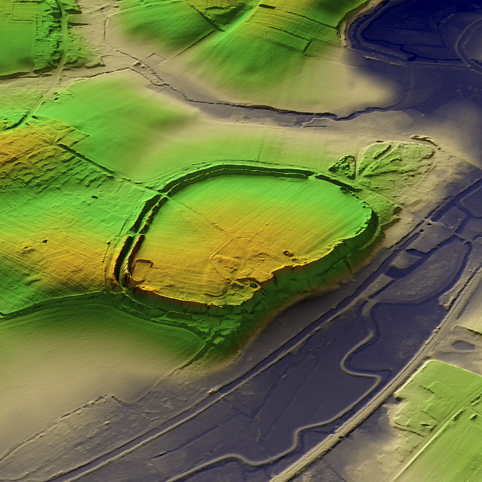 Wallbury Camp, UK, 3D LiDAR scan 3D LiDAR scan of Wallbury Camp in Essex, UK. This digital terrain model reveals the site hidden by foliage and the disrupted pattern of the landscape. This ancient hillfort is one of many found across the UK and dates back to the Iron Age, roughly between 700 BC and 43 AD. These hillforts served as fortified settlements or defensive structures for ancient communities, offering protection and strategic control over the surrounding territory. Wallbury Camp occupies a dominant site overlooking the River Stort and must have controlled the Stort Valley. Image contains UK public sector information licensed under the Open Government Licence v3.0., by SIMON TERREY SCIENCE PHOTO LIBRARY