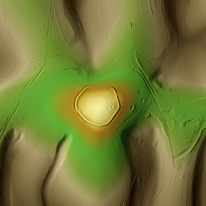 The Trundle, UK, 3D LiDAR scan 3D LiDAR scan of The Trundle, an Iron Age hillfort in Chichester, UK. The digital terrain model offers a view of the surrounding landscape without obstruction from foliage. This ancient hillfort is one of many found across the UK and dates back to the Iron Age, roughly between 700 BC and 43 AD. These hillforts served as fortified settlements or defensive structures for ancient communities, offering protection and strategic control over the surrounding territory. The Trundle is built on the site of a causewayed enclosure, a form of early Neolithic earthwork found in northwestern Europe. Image contains UK public sector information licensed under the Open Government Licence v3.0., by SIMON TERREY SCIENCE PHOTO LIBRARY