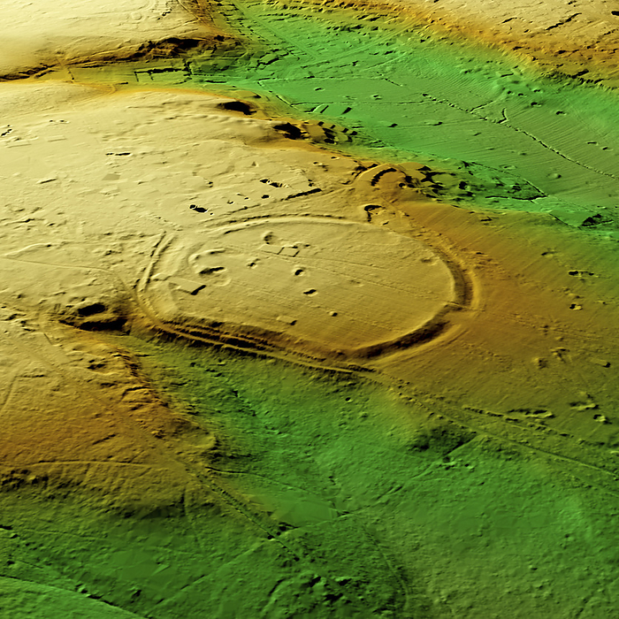 Caesar s Camp Iron Age hillfort, Wimbledon, 3D LiDAR scan 3D LiDAR scan of Caesar s Camp, an Iron Age hillfort located in Wimbledon, UK. Hillforts were settlements constructed on natural hills, usually fortified with earthworks around the contours of the hill. They were widely constructed across Europe, Great Britain, and Ireland in the centuries preceding the Roman conquest of the regions. This digital terrain model removes buildings and foliage, providing a view of the site that is mostly hidden by a golf course at the Royal Wimbledon Golf Club in southwest London. The circular contour of the site covers an area of nearly 45000 square meters. The site was granted monument status in 1932 and has been dated by pottery finds to 300 BC. An urn containing 1st century  Roman  coins was also discovered. Image contains UK public sector information licensed under the Open Government Licence v3.0., by SIMON TERREY SCIENCE PHOTO LIBRARY