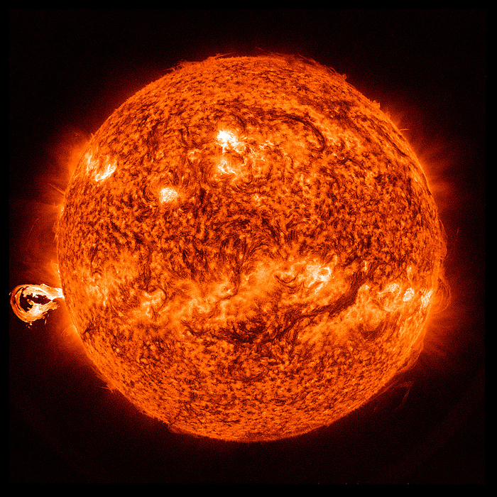 Eruption of solar material, SDO image Eruption of solar material launched from an active region  left  of the Sun classed as an M1 solar flare. This phenomenon occurs when magnetic energy that has built up in the solar atmosphere is suddenly released. Within just a few minutes, the material is heated to many millions of degrees and produces a burst of radiation across the electromagnetic spectrum. Imaged obtained at a wavelength of 304 angstroms by the Atmospheric Imaging Assembly  AIA  instrument on NASA s Solar Dynamics Observatory  SDO ., by NASA SCIENCE PHOTO LIBRARY