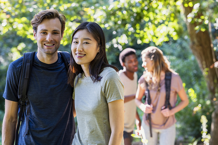 Young adult couple looking at the camera during hiking excursion