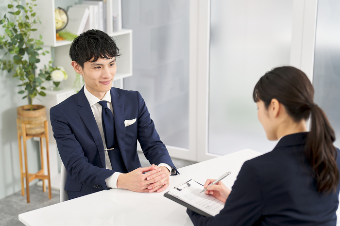 Japanese businessman being interviewed (People)