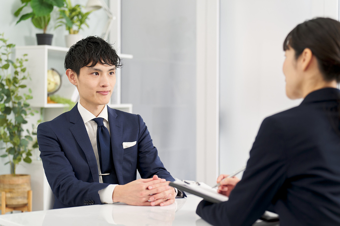 Japanese businessman being interviewed (People)
