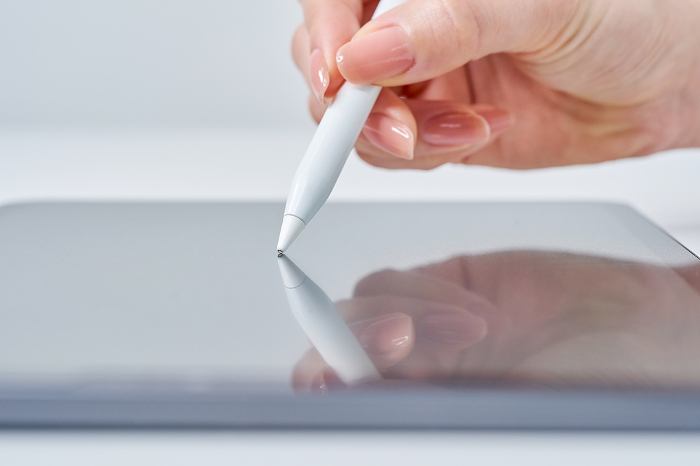 Woman's hand operating stylus pen