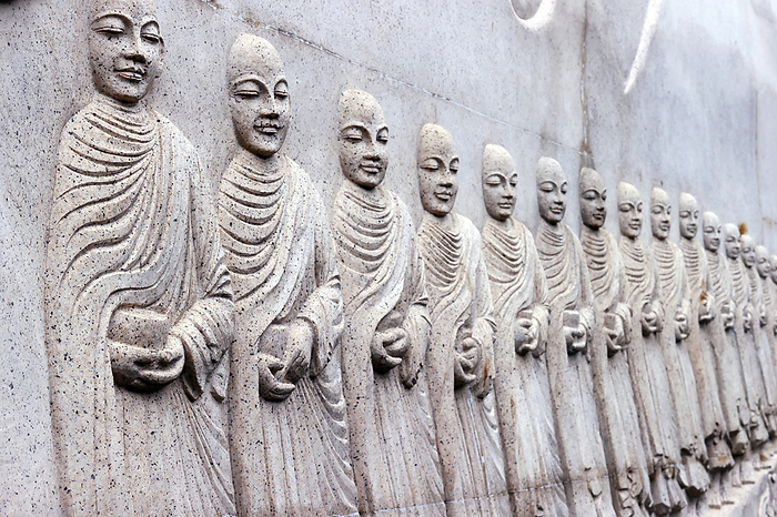 Phap Vien Minh Dang Quang pagoda. Sangha. Alms from monks. Ho Chi Minh city. Vietnam. Carved relief showing Buddhist monks  Sangha  with alms bowls, Phap Vien Minh Dang Quang pagoda, Ho Chi Minh City, Vietnam, Indochina, Southeast Asia, Asia, by Godong