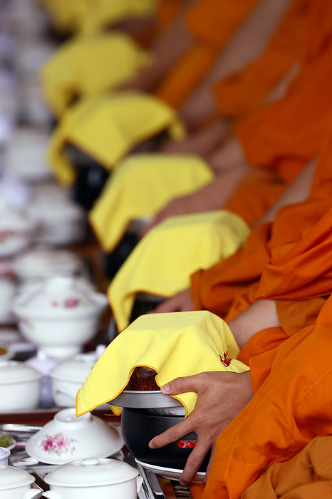 Phuoc Hue buddhist pagoda. Monks at buddhist ceremony in the main hall. Vegetarian meal. Vietnam. Vegetarian meal, monks at Buddhist ceremony in the main hall, Phuoc Hue Buddhist pagoda, Tan Chau, Vietnam, Indochina, Southeast Asia, Asia, by Godong