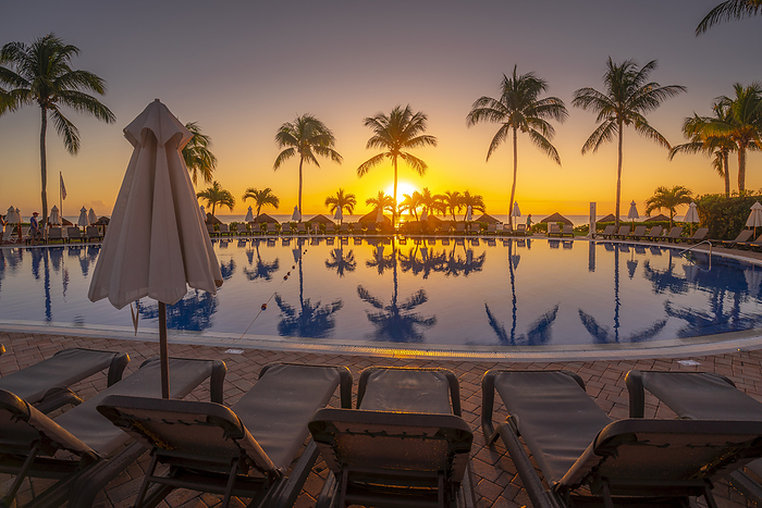 View of sunrise and hotel pool near Puerto Morelos, Caribbean Coast, Yucat n Peninsula, Mexico, North America View of sunrise and palm tree reflections in hotel pool near Puerto Morelos, Caribbean Coast, Yucatan Peninsula, Mexico, North America, by Frank Fell
