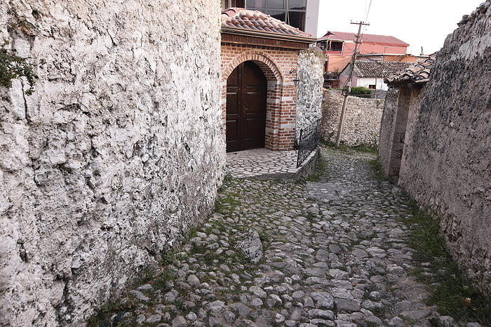 Narrow street of Kruje within the walls of the Castle, Kruje, Albania, Europe Narrow street of Kruje within the walls of the Castle, Kruje, Albania, Europe, by Michael Szafarczyk