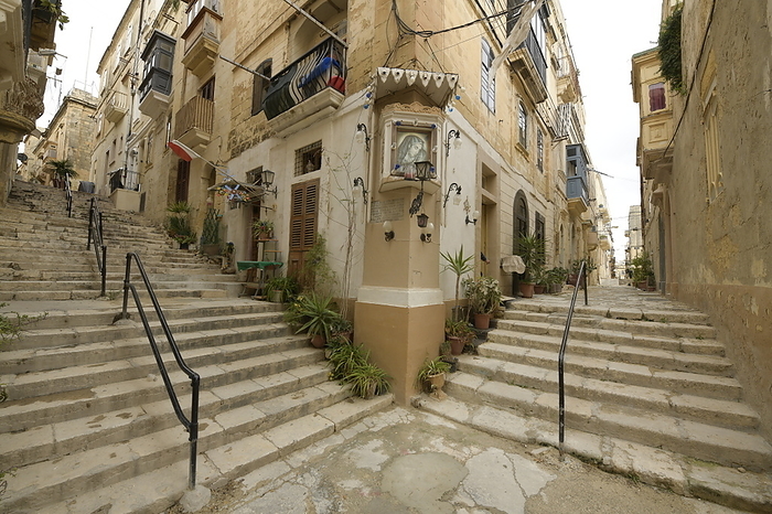 Corner with stairs and picture of the Virgin Mary on a street in Senglea, Malta Corner with stairs and picture of the Virgin Mary on a street in Senglea, Malta, Mediterranean, Europe, by Michael Szafarczyk