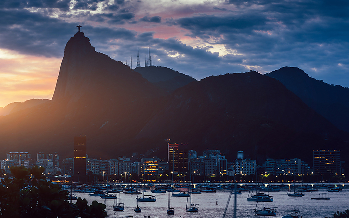 View of Botafogo Bay in Rio de Janeiro, Brazil at sunset with Christ the Redeemer statue in the background   UNESCO World Heritage Site   between the Mountain and the Sea was inscribed on the World Heritage List in 2012 View of Botafogo Bay at sunset with Christ the Redeemer statue in the background, UNESCO World Heritage Site, between the Mountain and the Sea, inscribed on the World Heritage List in 2012, Rio de Janeiro, Brazil, South America, by Alexandre Rotenberg