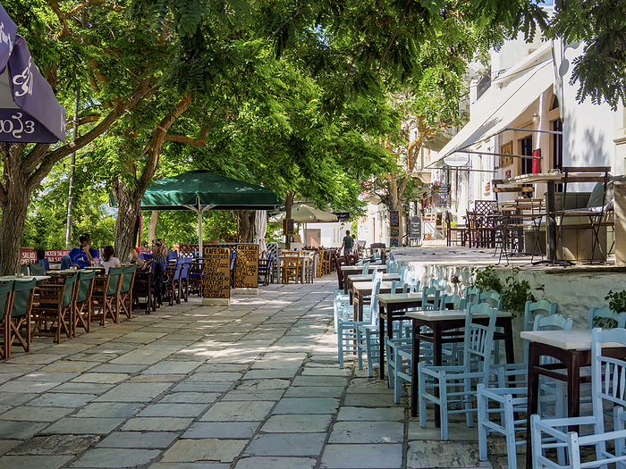 Street of Apeiranthos Village, Naxos Island, Cyclades, Greece Street of Apeiranthos Village and cafe tables, Naxos Island, Cyclades, Greek Islands, Greece, Europe, by Karol Kozlowski
