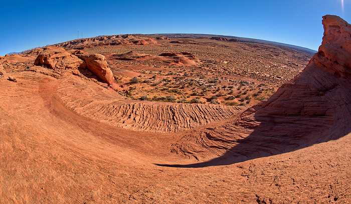 A wavy sandstone slope, which is a fossilized sand dune, at Ferry Swale in the Glen Canyon Recreation Area near Page Arizona. A wavy sandstone slope, a fossilized sand dune, at Ferry Swale in the Glen Canyon Recreation Area near Page, Arizona, United States of America, North America, by Steven Love