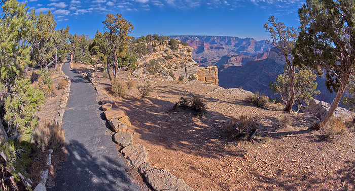The paved rim trail along the cliffs of Grand Canyon South Rim Arizona between the Trailview Overlook East Vista and the West Vista. The paved rim trail along the cliffs of Grand Canyon South Rim between the Trailview Overlook East Vista and the West Vista, Grand Canyon, UNESCO World Heritage Site, Arizona, United States of America, North America, by Steven Love