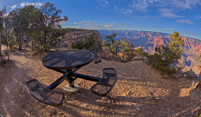 A metal picnic table along the rim trail overlooking Grand Canyon South Rim Arizona off of Hermit Road just west of Hopi Point. A metal picnic table along the rim trail overlooking Grand Canyon South Rim off of Hermit Road just west of Hopi Point, Grand Canyon, UNESCO World Heritage Site, Arizona, United States of America, North America, by Steven Love