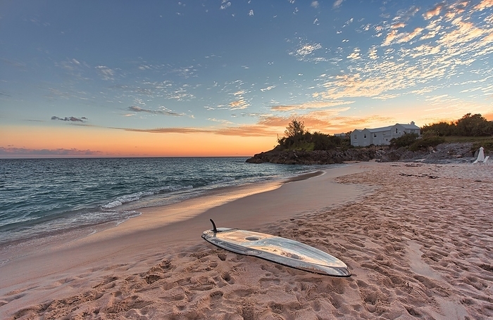 Paddleboard on the beach at sunset, Bermuda South Shore. Paddleboard on the beach at sunset, Bermuda South Shore, Bermuda, North Atlantic, North America, by Barry Davis