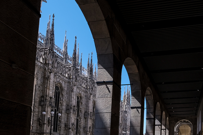 View of the Milan Cathedral  Italian, Duomo di Milano , the cathedral church of Milan in Lombardy, Italy, from one of the surrounding buildings in the Piazza del Duomo  Cathedral Square , the main city square. View of Milan Cathedral  Duomo di Milano , dedicated to the Nativity of St. Mary, from a nearby building in the Piazza del Duomo, Milan, Lombardy, Italy, Europe, by MLTZ