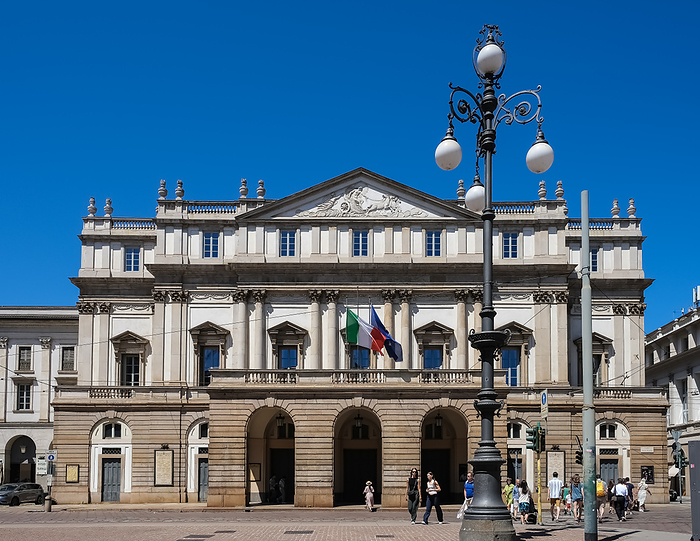 Exterior of La Scala, a renowned opera house in Milan, Italy, located in Piazza della Scala. Recognized globally, it has hosted performances by leading Italian opera artists and acclaimed singers from around the world. Exterior of La Scala, world renowned Opera House, Piazza della Scala, Milan, Lombardy, Italy, Europe, by MLTZ