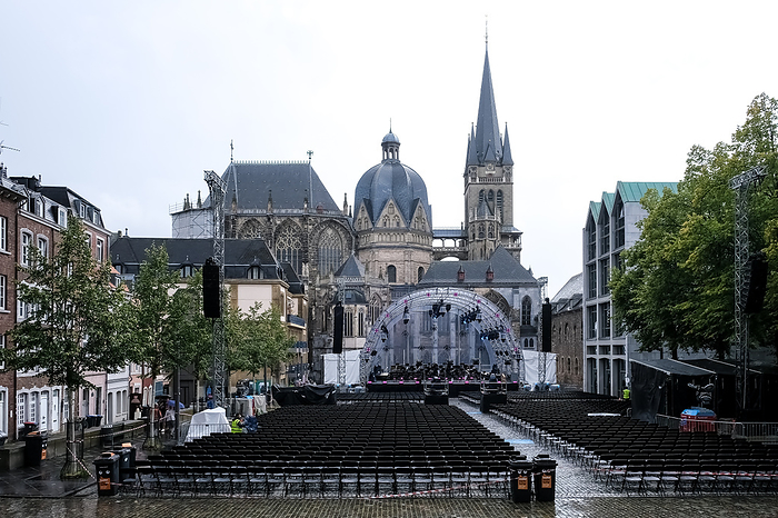 View of Katschhof, a tree filled square that hosts various festivals and markets, with the iconic Aachen Cathedral, one of the oldest cathedrals in Europe, in the background of this picturesque setting in Aachen, Germany Katschhof, a tree filled square, location of festivals and markets, with the iconic Aachen Cathedral, one of the oldest cathedrals in Europe behind, Aachen, North Rhine Westphalia, Germany, Europe, by MLTZ