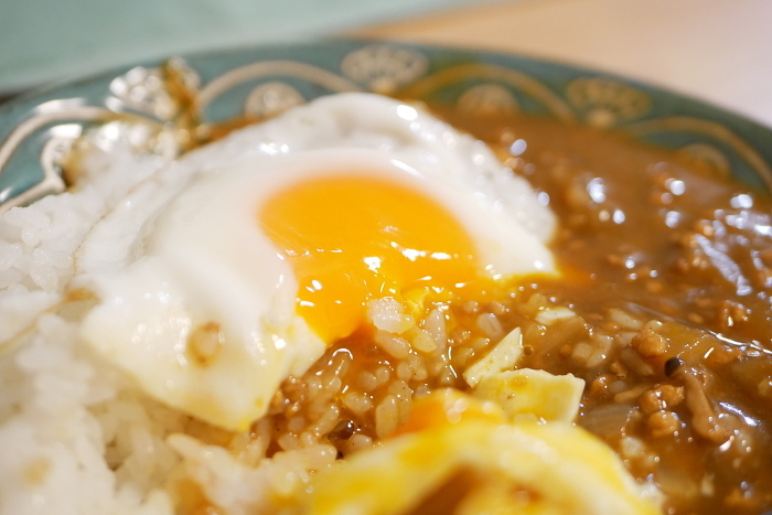 Homemade curry and rice with fried egg on top