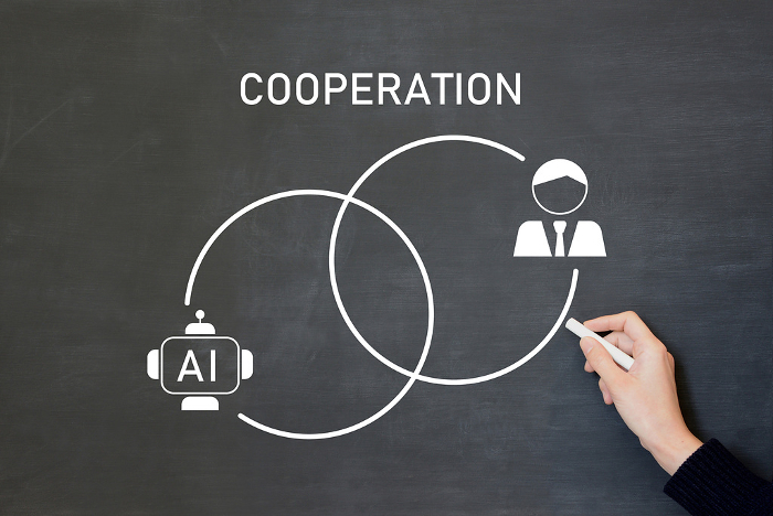 Image of cooperation and coexistence between AI and business people