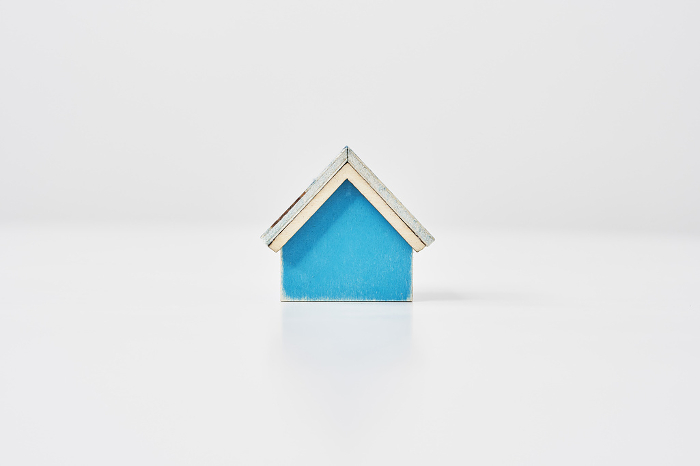 Blue house model on a white table