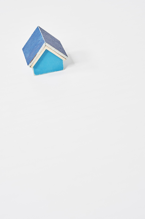 Blue house model on a white table