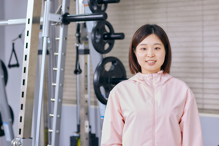 Smiling Japanese woman at the gym