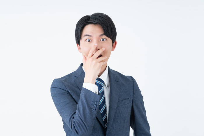 A surprised young Japanese businessman (People)