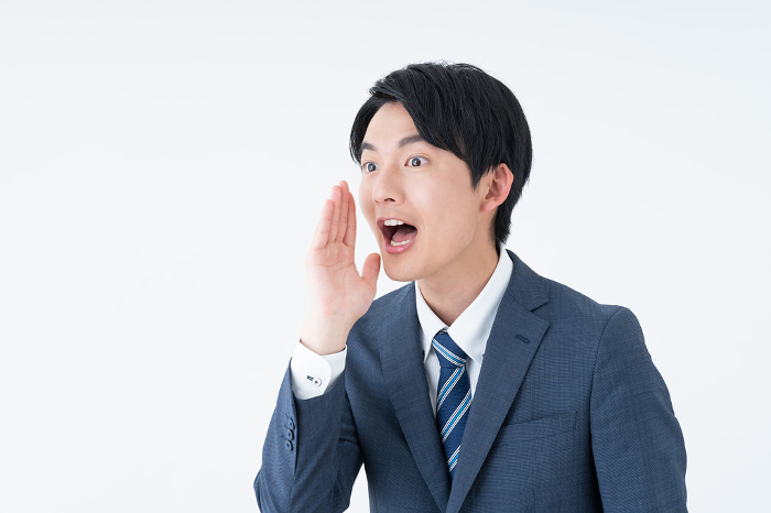 Young Japanese businessman shouting (People)