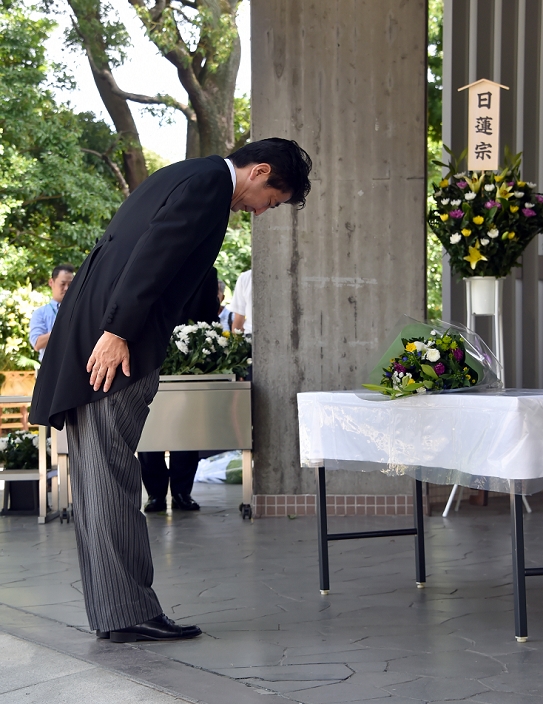 69th End of War Memorial Day Prime Minister and others offer flowers at war dead cemetery August 15, 2014, Tokyo, Japan   Japan s Prime Minister Shinzo Abe in ceremonial attire offers flowers to the war dead as he visits Chidorigafuchi National Cemeteryin Tokyo on Friday, August 15, 2014, as Japan observes the 69th anniversary of the nation s surrender in World War II. Abe opted not to visit the nearby Yasukuni Shrine as did senior government officials but sent a ritual offering instead.  Photo by Katsumi Kasahara AFLO  AYF  mis 