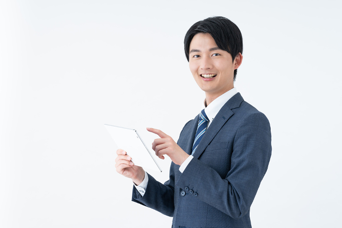 Young Japanese businessman using a tablet (People)