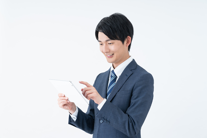 Young Japanese businessman using a tablet (People)