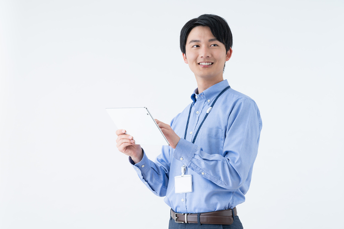Young Japanese engineer using a tablet (Male / People)