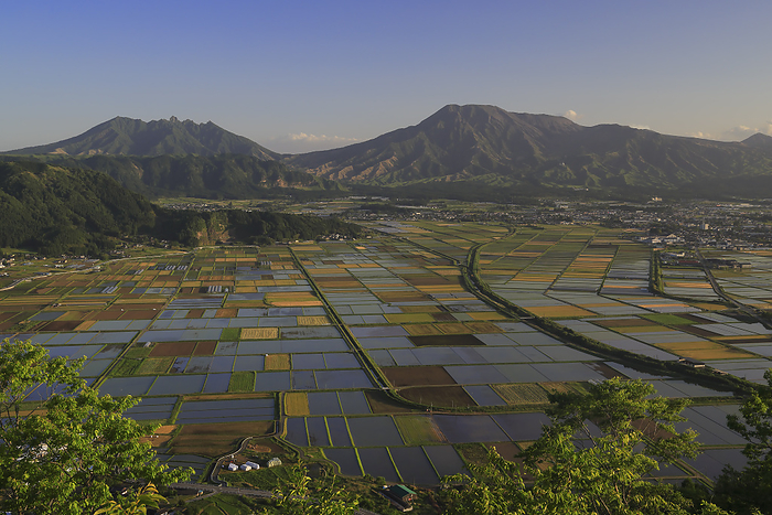 Paddy fields in Aso Caldera and the five Aso peaks at dusk, Kumamoto, Japan Taken from Shiroyama Observatory