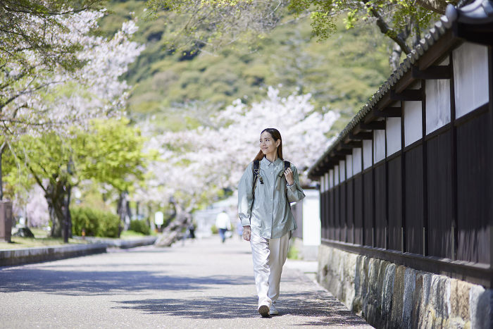 Inbound tourist woman walking in spring tourist area