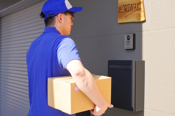 Delivery person to deliver packages to residences