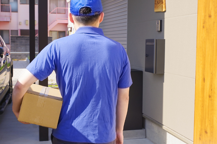 Delivery person to deliver packages to residences