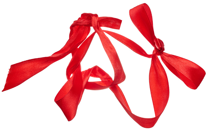 Piece of red satin ribbon on isolated background, top view Piece of red satin ribbon on isolated background, top view